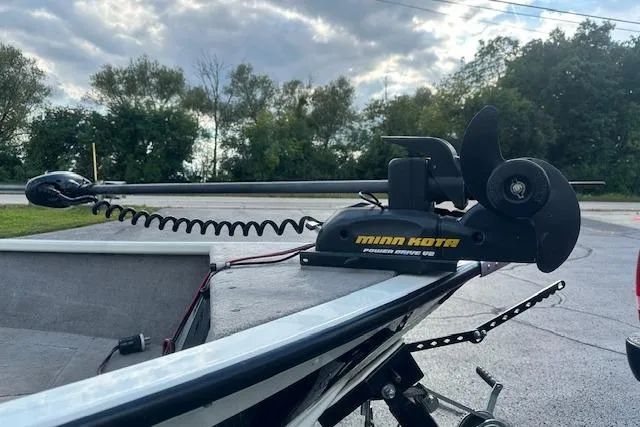 Slide: The Image of 2012 Smoker Craft Pro Angler XL 162 with Minn Kota trolling motor, parked outdoors. - 4