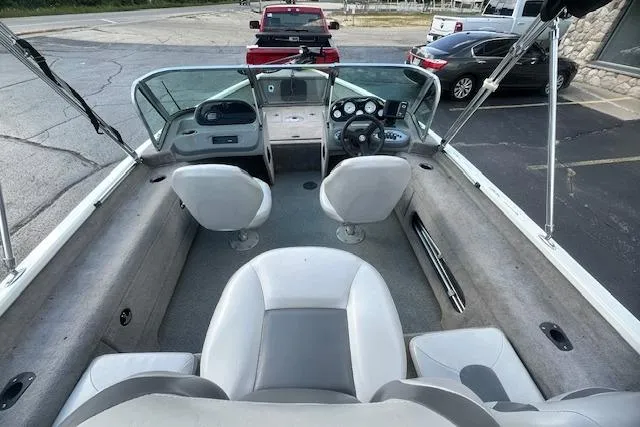 Slide: The Image of 2012 Smoker Craft Pro Angler XL 162 boat interior with seating and dashboard view. - 7