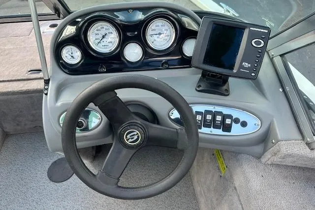 Slide: The Image of 2012 Smoker Craft Pro Angler XL 162 dashboard with steering wheel and electronic display. - 9