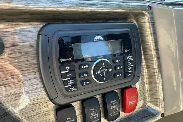 Slide: The Image of Boat dashboard with audio controls and switches, Premier 220 Gemini, 2019 model. - 12