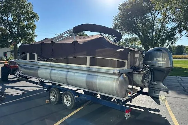 Slide: The Image of 2019 Premier 220 Gemini pontoon boat on trailer with Yamaha outboard motor. - 29