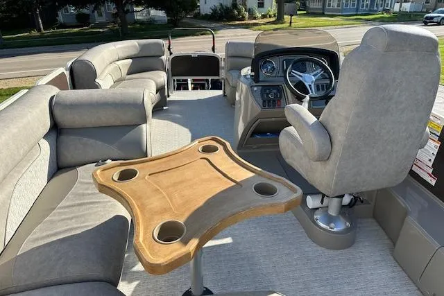 Slide: The Image of Premier 220 Gemini 2019 pontoon boat interior with seating and steering console. - 8