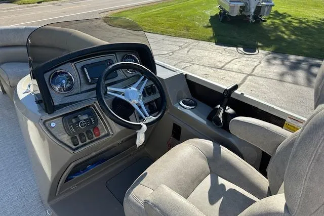Slide: The Image of 2019 Premier 220 Gemini boat cockpit with steering wheel and controls. - 9