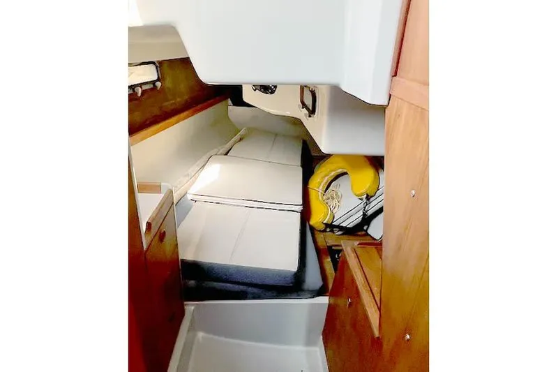 Slide: The Image of Interior cabin of 1988 O'Day 322 sailboat with cushions and storage. - 16