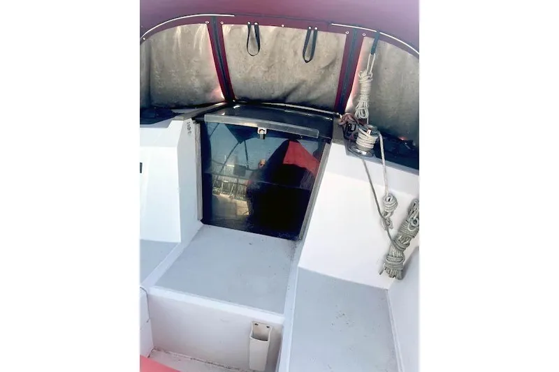Slide: The Image of 1988 O'Day 322 sailboat cockpit with ropes and covered seating area. - 3