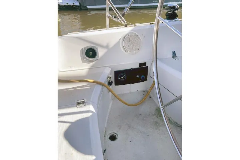 Slide: The Image of Cockpit of 1988 O'Day 322 sailboat with steering wheel and control panel. - 9