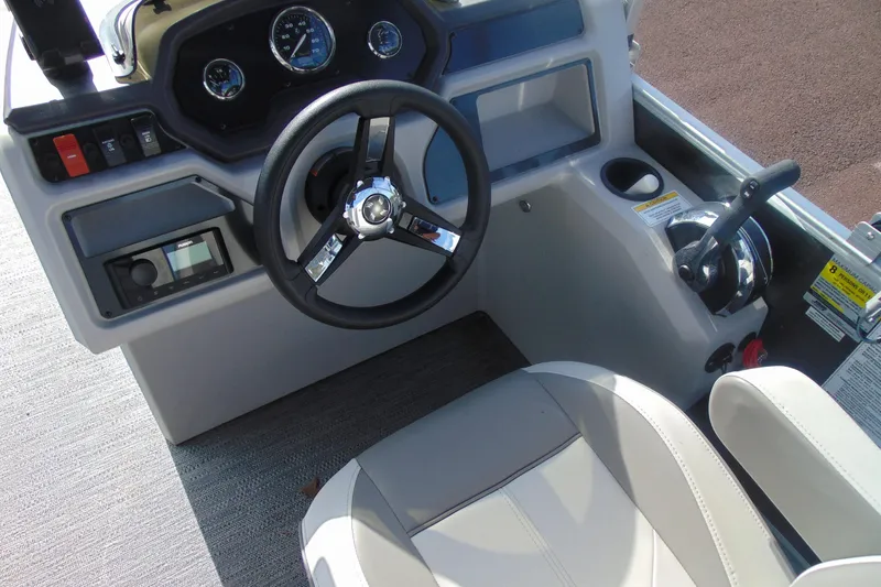 Slide: The Image of 2022 Godfrey Sweetwater 1680 CX boat dashboard with steering wheel and controls. - 11