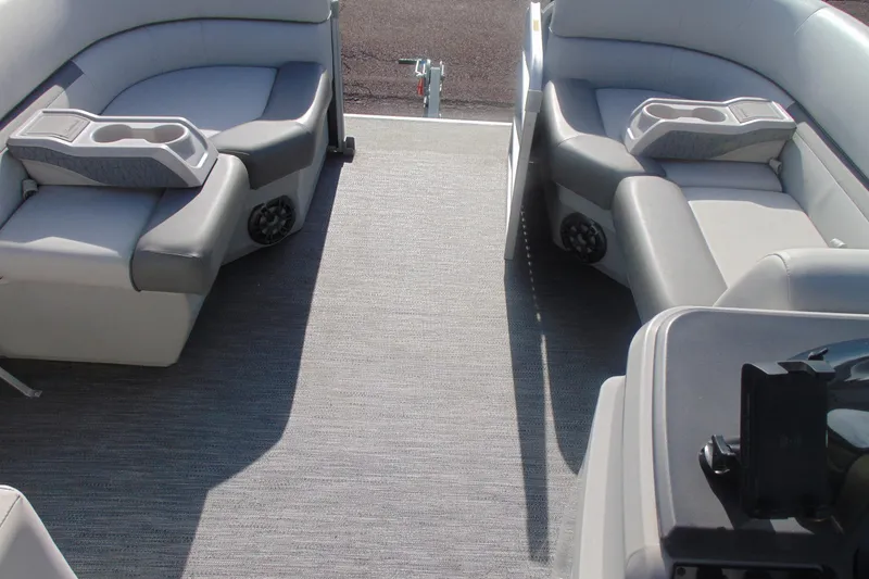 Slide: The Image of Interior of 2022 Godfrey Sweetwater 1680 CX pontoon boat with gray seating and cup holders. - 13