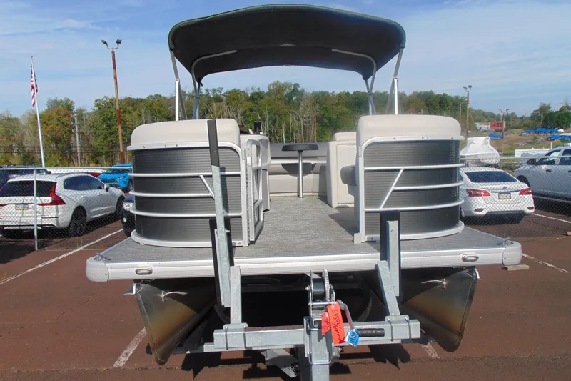 Slide: The Image of 2022 Godfrey Sweetwater 1680 CX pontoon boat on trailer in parking lot. - 2