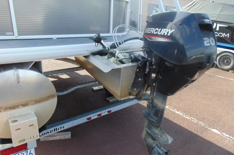 Slide: The Image of 2022 Godfrey Sweetwater 1680 CX with Mercury 20 outboard motor on trailer. - 6