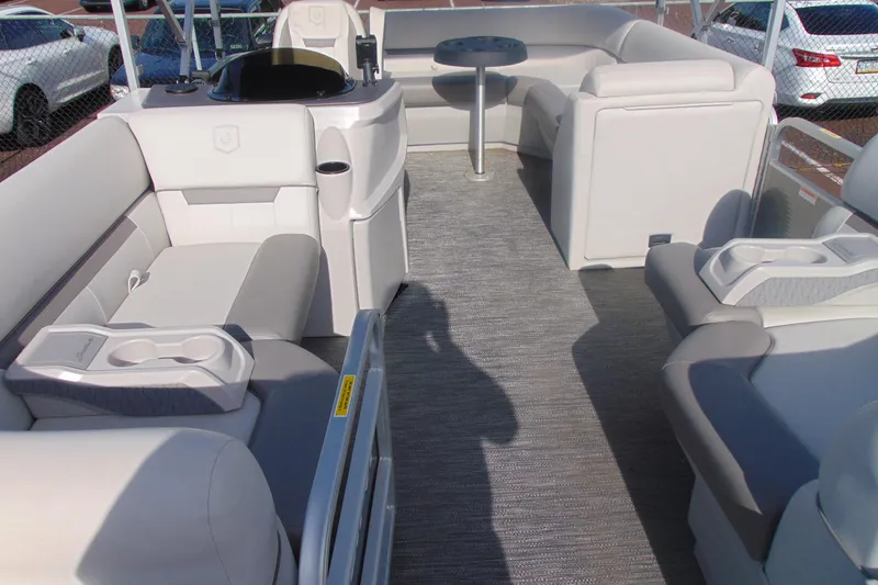 Slide: The Image of 2022 Godfrey Sweetwater 1680 CX pontoon boat interior with plush seating and table. - 7