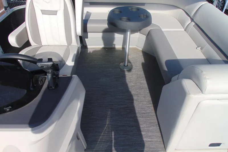 Slide: The Image of Interior of 2022 Godfrey Sweetwater 1680 CX pontoon boat with seating and table. - 8