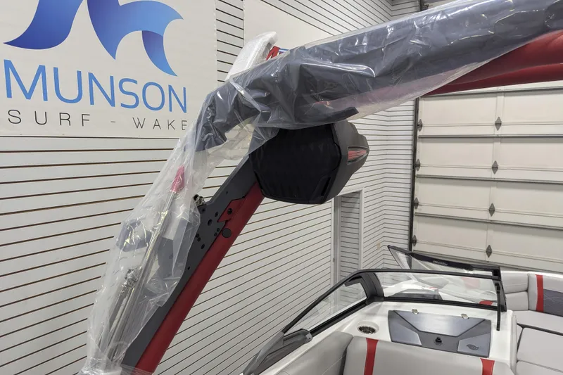 Slide: The Image of 2026 Malibu Wakesetter 23 LSV boat in showroom, featuring sleek design and modern features. - 10