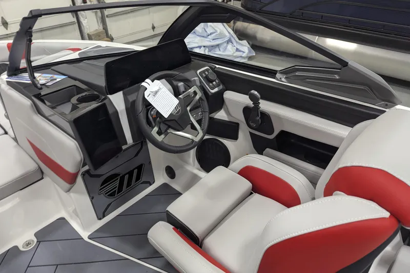 Slide: The Image of 2026 Malibu Wakesetter 23 LSV interior with modern dashboard and red-accented seating. - 13