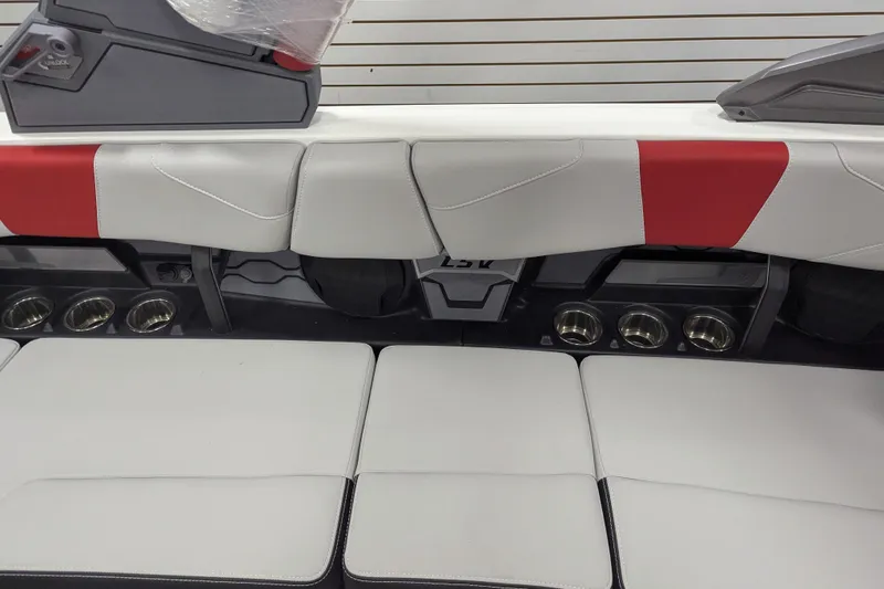 Slide: The Image of 2026 Malibu Wakesetter 23 LSV interior seating with red and white upholstery. - 17