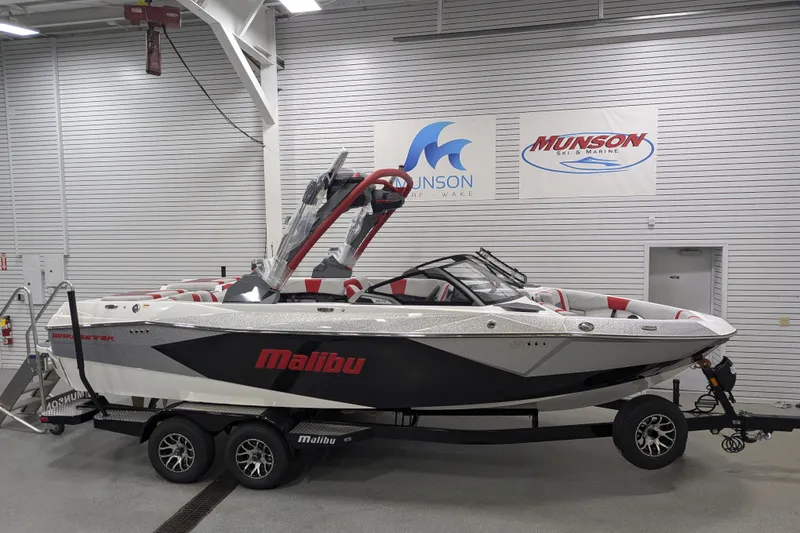 Slide: The Image of 2026 Malibu Wakesetter 23 LSV boat in showroom, featuring sleek design and modern features. - 20