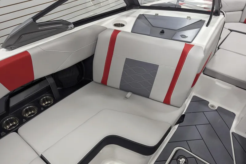 Slide: The Image of 2026 Malibu Wakesetter 23 LSV interior with red and gray seating, cup holders, and sleek design. - 22