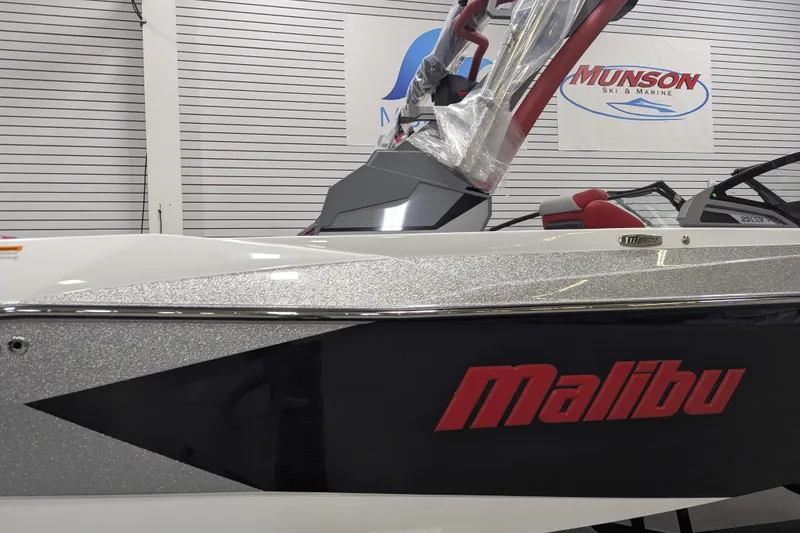 Slide: The Image of 2026 Malibu Wakesetter 23 LSV boat displayed at Munson Ski & Marine showroom. - 5