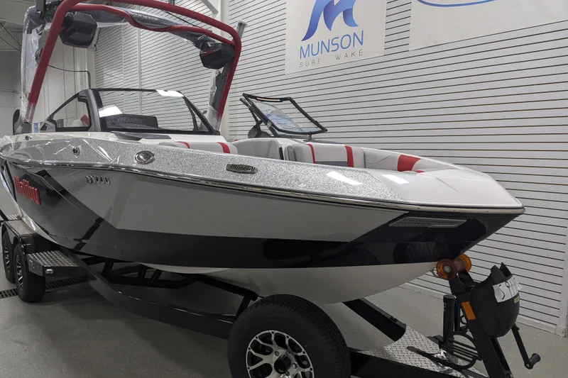 Slide: The Image of 2026 Malibu Wakesetter 23 LSV boat in showroom, featuring sleek design and modern features. - 6