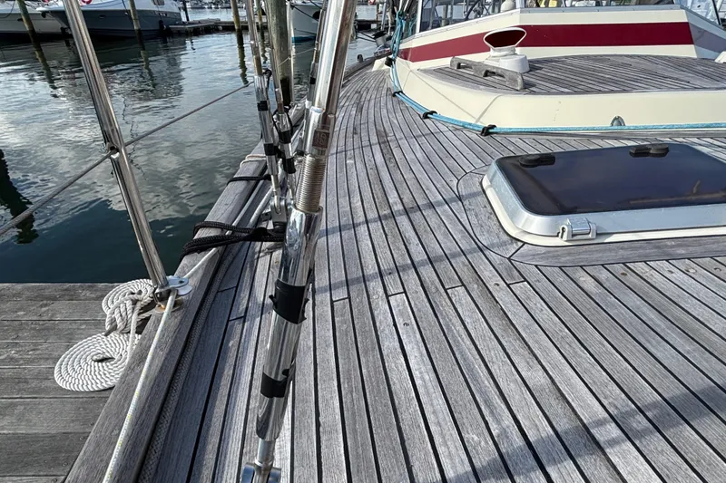 Slide: The Image of Deck of 1992 Najad 390 sailboat with wooden finish and hatch, docked at marina. - 11