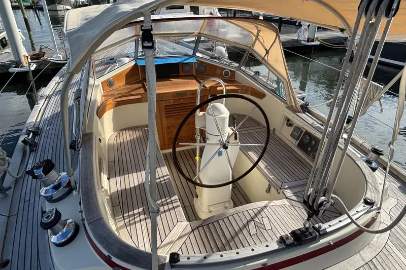 Slide: The Image of Cockpit of 1992 Najad 390 sailboat with wooden accents and steering wheel. - 18