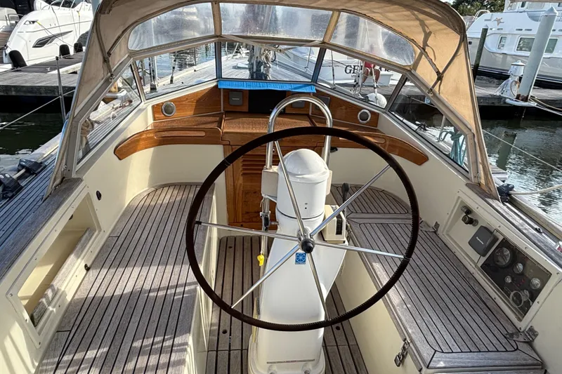 Slide: The Image of Cockpit of 1992 Najad 390 sailboat with wooden accents and steering wheel. - 20