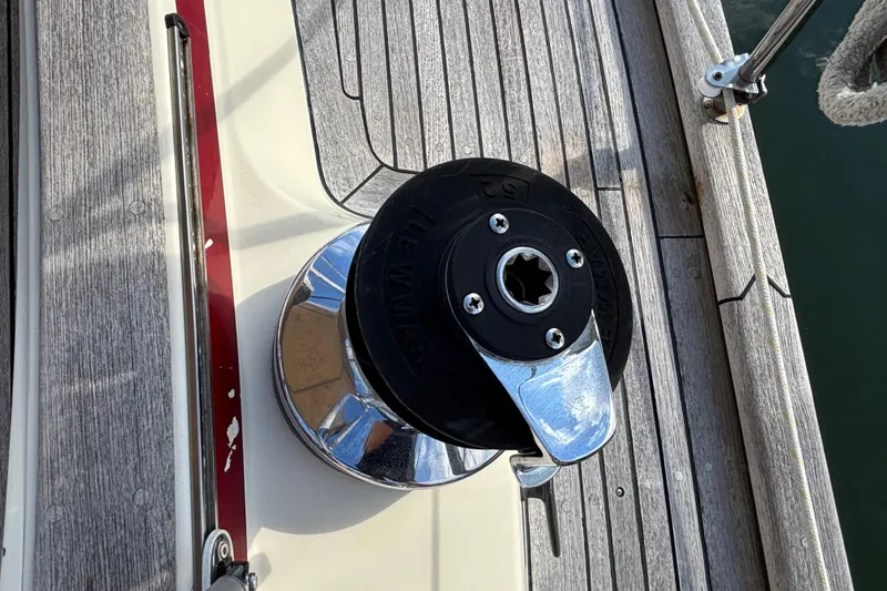 Slide: The Image of Winch on deck of 1992 Najad 390 sailboat, featuring teak wood finish. - 22