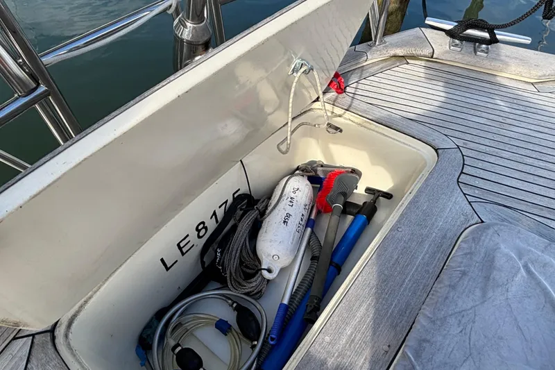 Slide: The Image of Storage compartment on a 1992 Najad 390 yacht, containing marine equipment and tools. - 26