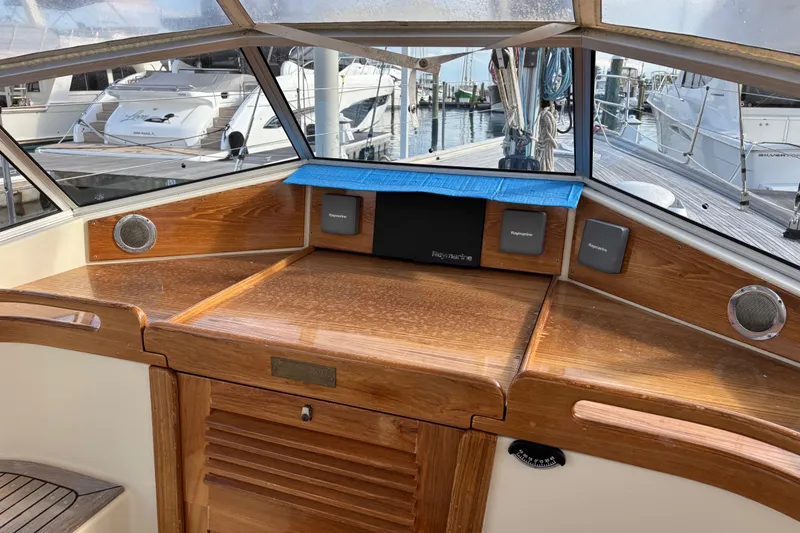 Slide: The Image of Cockpit of 1992 Najad 390 yacht with wooden finish and navigation equipment. - 29