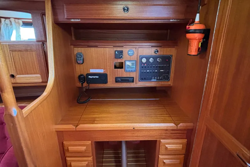 Slide: The Image of Navigation station of 1992 Najad 390 yacht with control panel and equipment. - 35