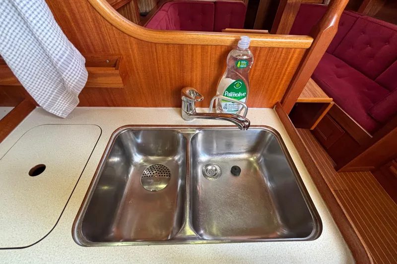 Slide: The Image of Stainless steel sink in 1992 Najad 390 yacht kitchen with wooden cabinetry. - 50