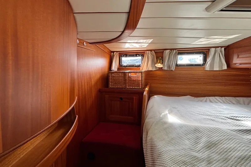 Slide: The Image of Cozy cabin interior of 1992 Najad 390 yacht with wooden finish and comfortable bedding. - 56