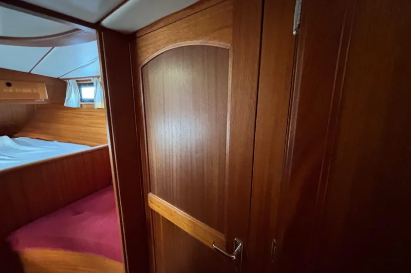 Slide: The Image of Interior of 1992 Najad 390 yacht with wooden cabin and cozy bed. - 61