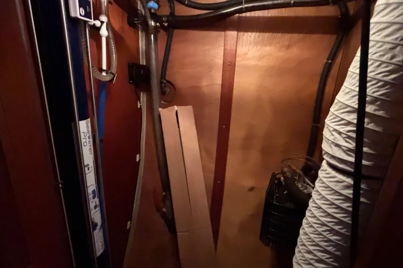 Slide: The Image of Interior view of Najad 390 yacht, showcasing pipes and equipment, 1992 model. - 62