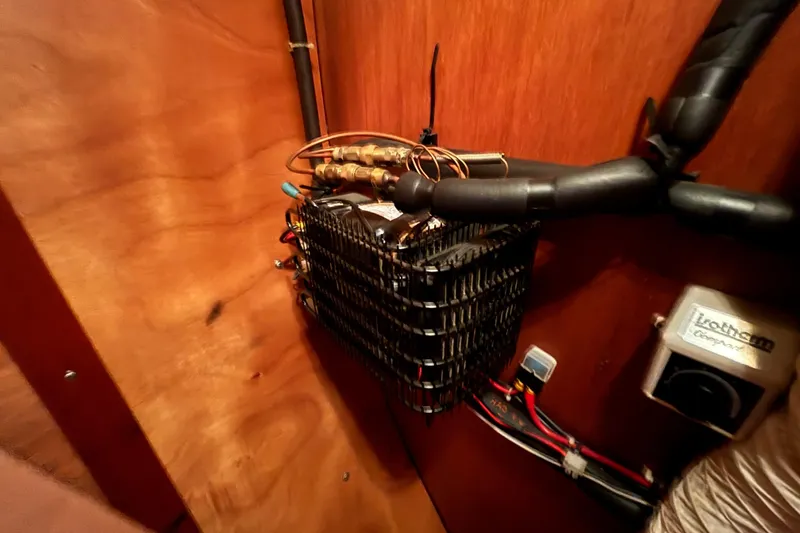 Slide: The Image of Electrical components and wiring inside a 1992 Najad 390 yacht. - 63