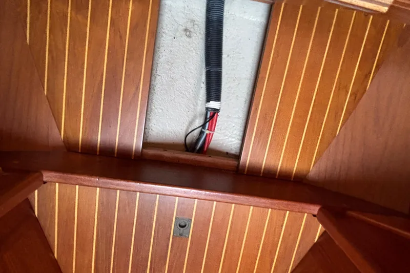 Slide: The Image of Interior view of 1992 Najad 390 yacht with wooden flooring and visible wiring. - 70