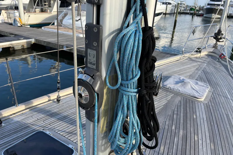 Slide: The Image of Deck of 1992 Najad 390 sailboat with ropes and marina view. - 76