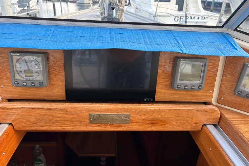 Slide: The Image of Control panel of a 1992 Najad 390 sailboat with Raymarine instruments. - 77