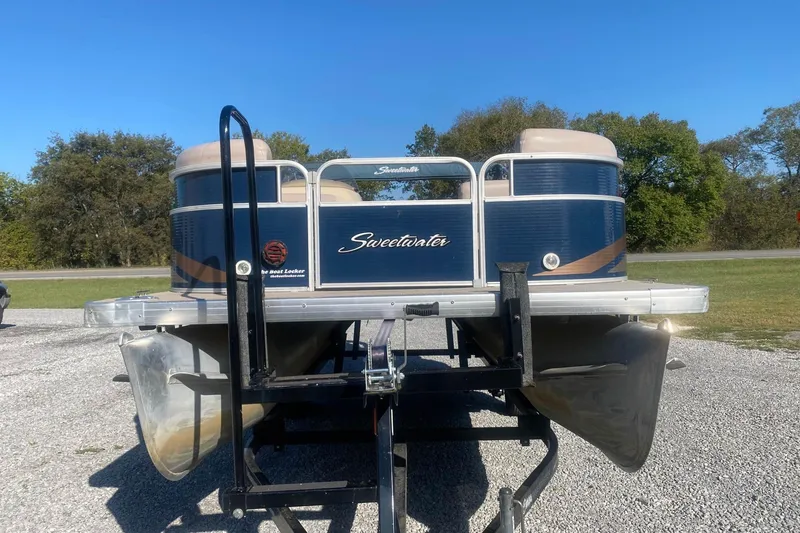 Slide: The Image of 2014 Godfrey SWEETWATER 2086 pontoon boat on trailer, parked outdoors. - 0