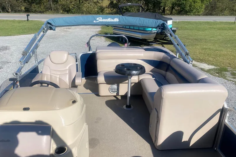 Slide: The Image of 2014 Godfrey SWEETWATER 2086 pontoon boat with beige seating and steering console. - 6