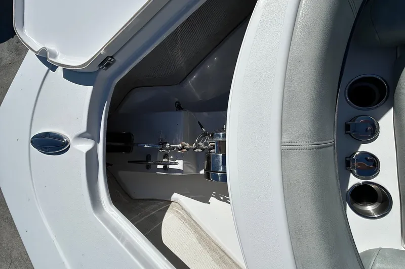 Slide: The Image of 2019 Sportsman Open 282 Center Console boat interior with storage compartment and seating. - 18