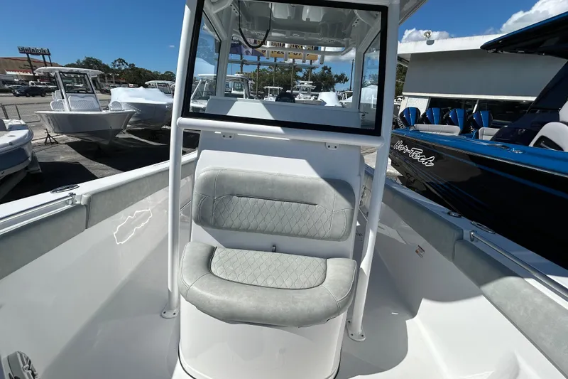 Slide: The Image of 2019 Sportsman Open 282 Center Console boat interior with cushioned seating. - 19