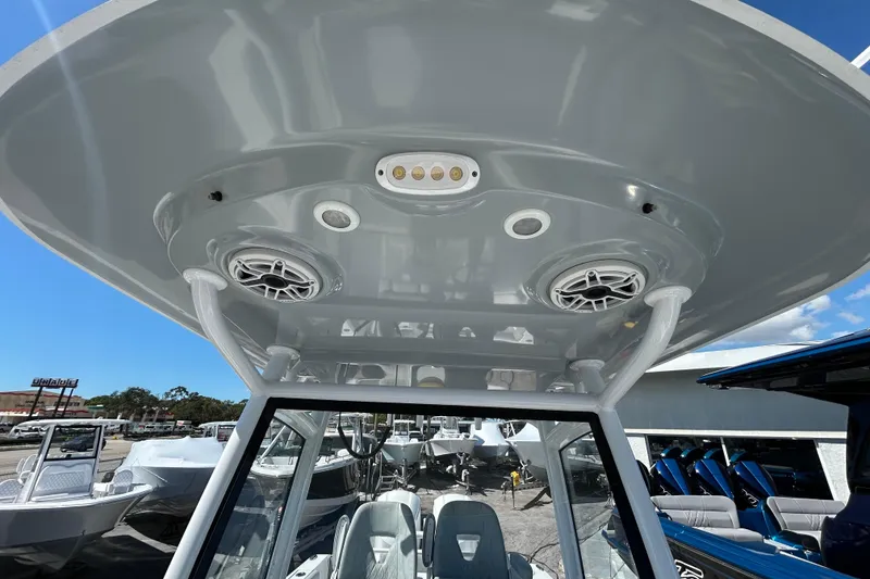 Slide: The Image of 2019 Sportsman Open 282 Center Console boat interior with speakers and lighting. - 21