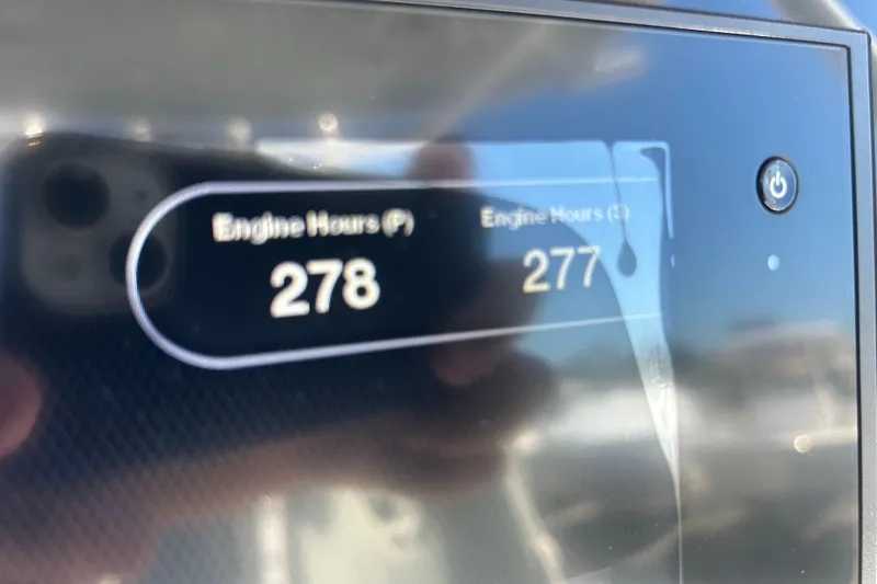 Slide: The Image of Close-up of 2019 Sportsman Open 282 Center Console engine hours display. - 24