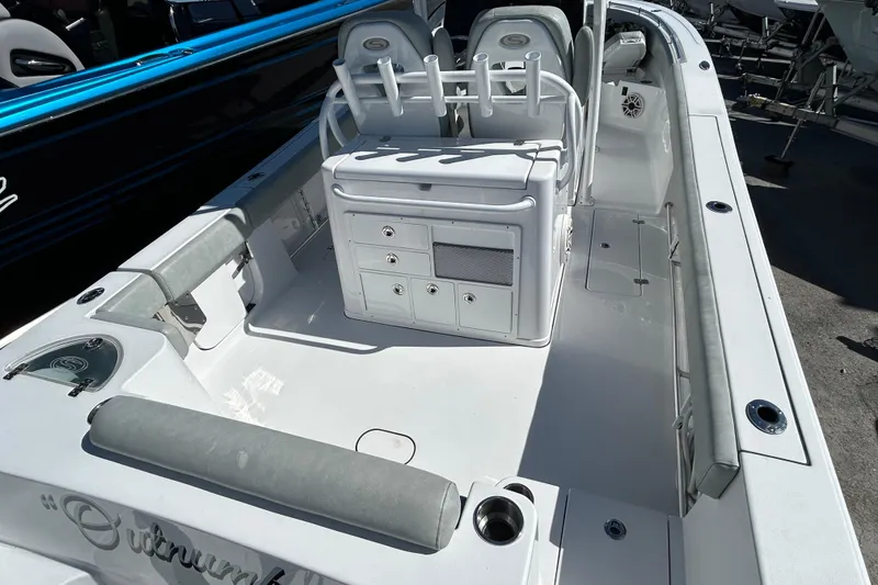 Slide: The Image of 2019 Sportsman Open 282 Center Console boat interior with seating and storage. - 8