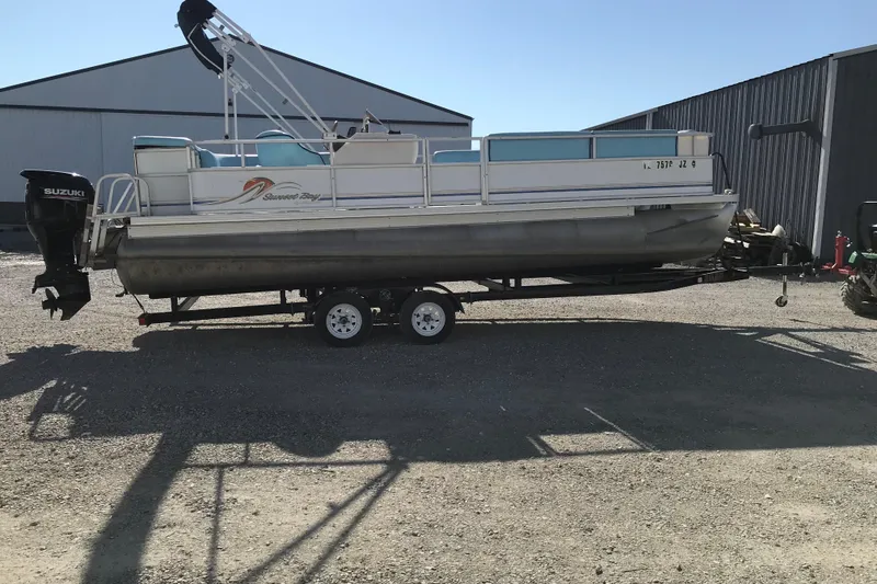 Slide: The Image of 2006 Sunset Bay CRUISE DELUXE pontoon boat on trailer, parked outdoors. - 8