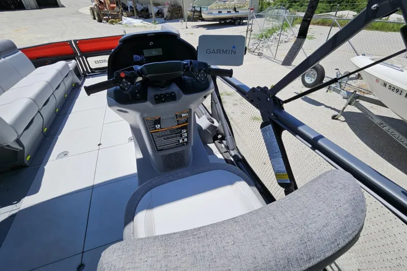Slide: The Image of 2024 Seadoo Cruise 21 dashboard with Garmin navigation, featuring spacious seating and modern controls. - 5