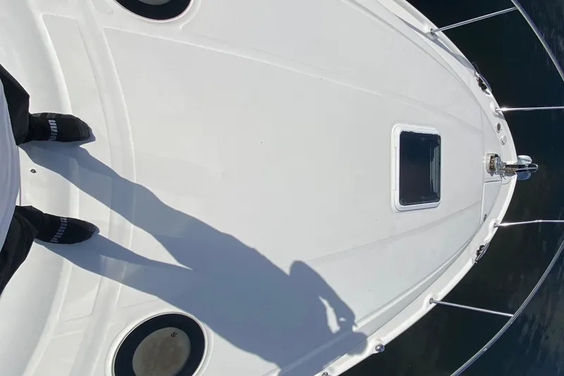 Slide: The Image of Overhead view of 2002 Sea Ray 320 Sundancer boat deck with shadow. - 17
