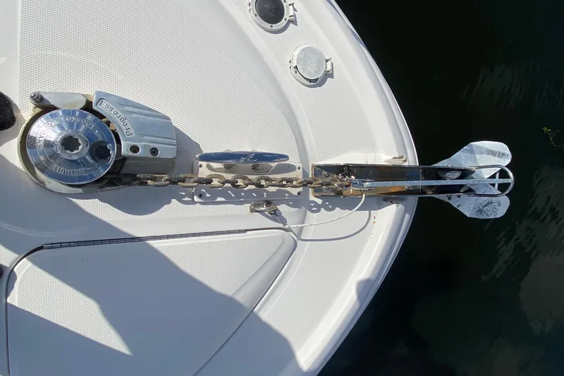 Slide: The Image of Anchor and windlass on 2002 Sea Ray 320 Sundancer boat deck. - 18