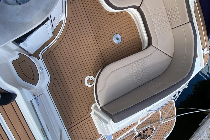 Slide: The Image of Luxurious seating on 2002 Sea Ray 320 Sundancer boat with teak flooring. - 27